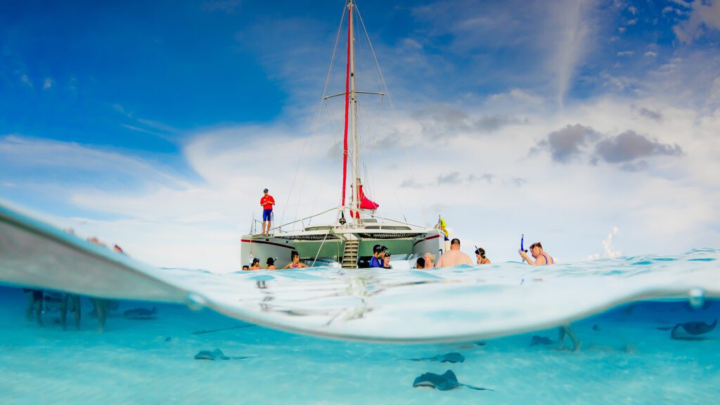 Red Sail Sports Catamaran at Stingray Sandbar in Grand Cayman