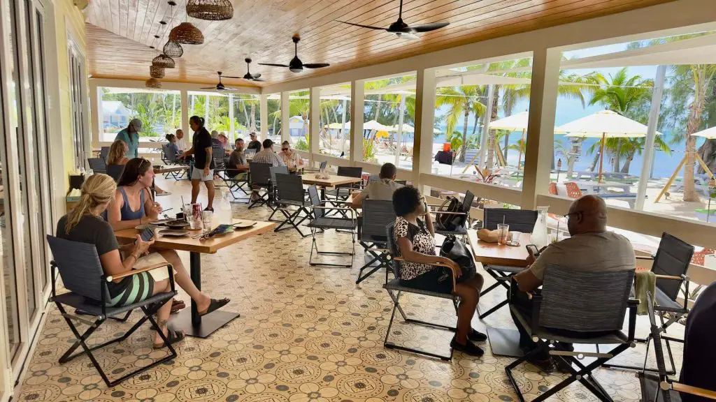 People enjoying their meals in Rum Point Club Solis Restaurant