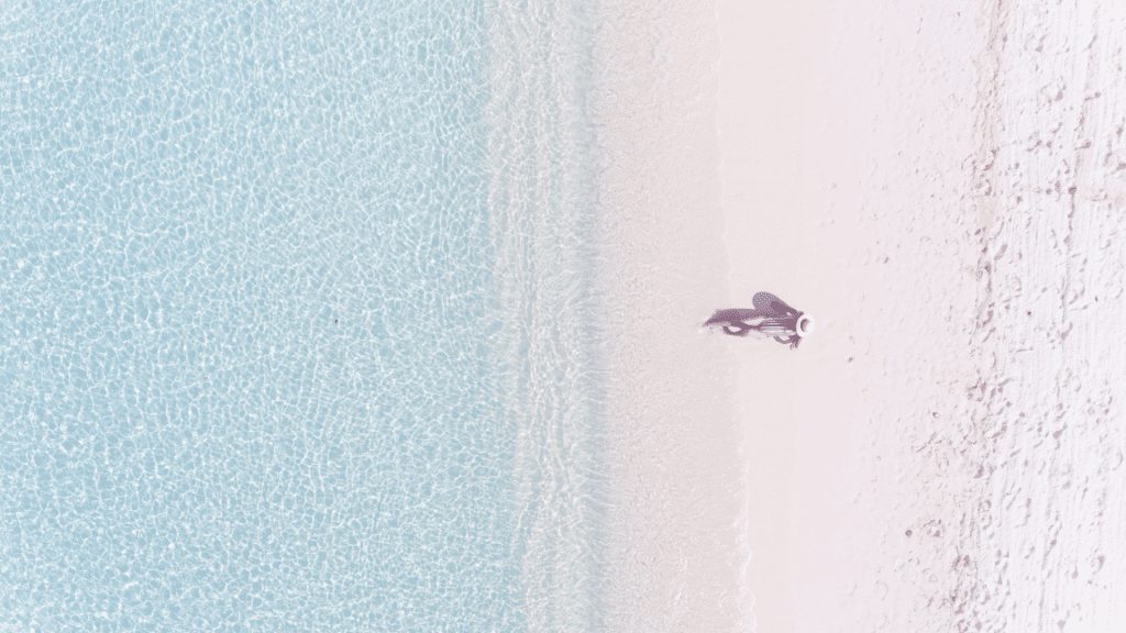 an aerial view of woman on the beach